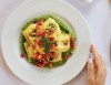 Ravioli with speck and robiola cheese, zucchini, tomatoes and basil